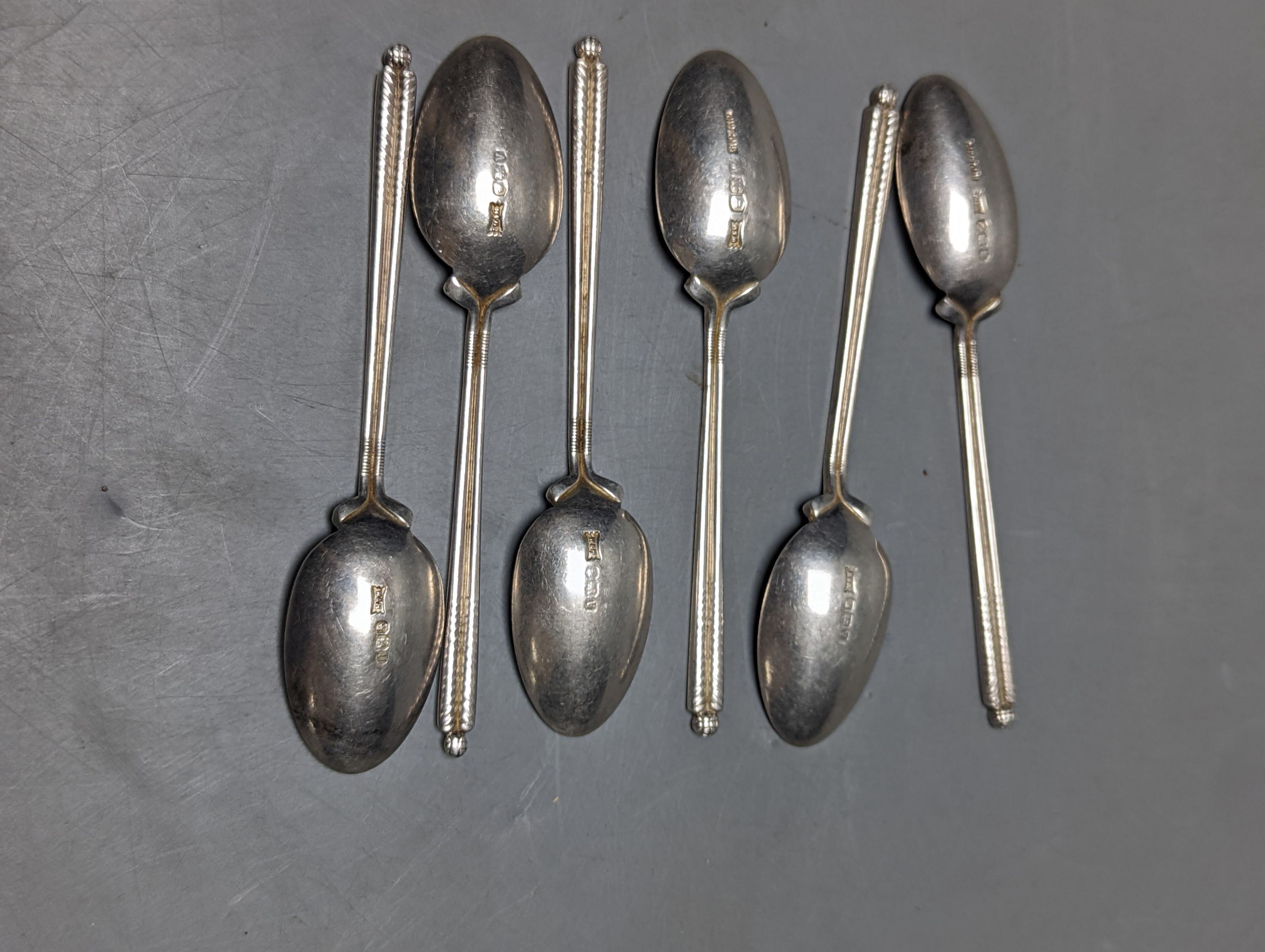 A set of six 1960's silver golfing related coffee spoons, by Walker & Hall, 68 grams.